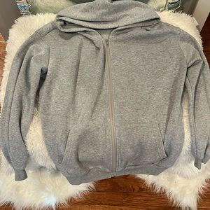 It’s a woman’s grey zip up sweatshirt